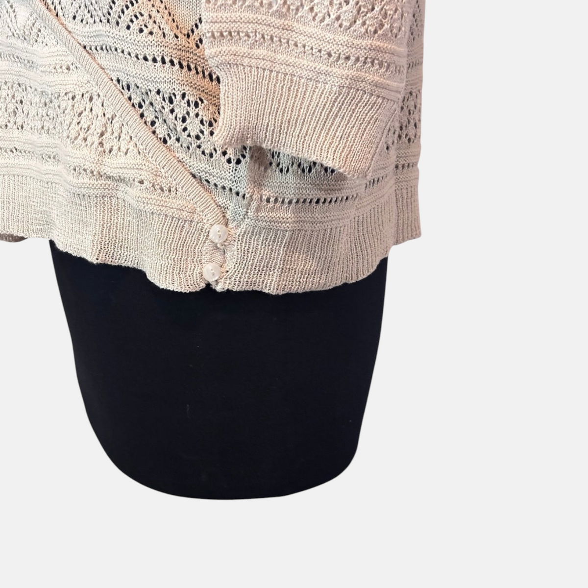 Omayra Boutique cream V-neck crossover wrap top in a textured knit cotton-acrylic blend with button detail.