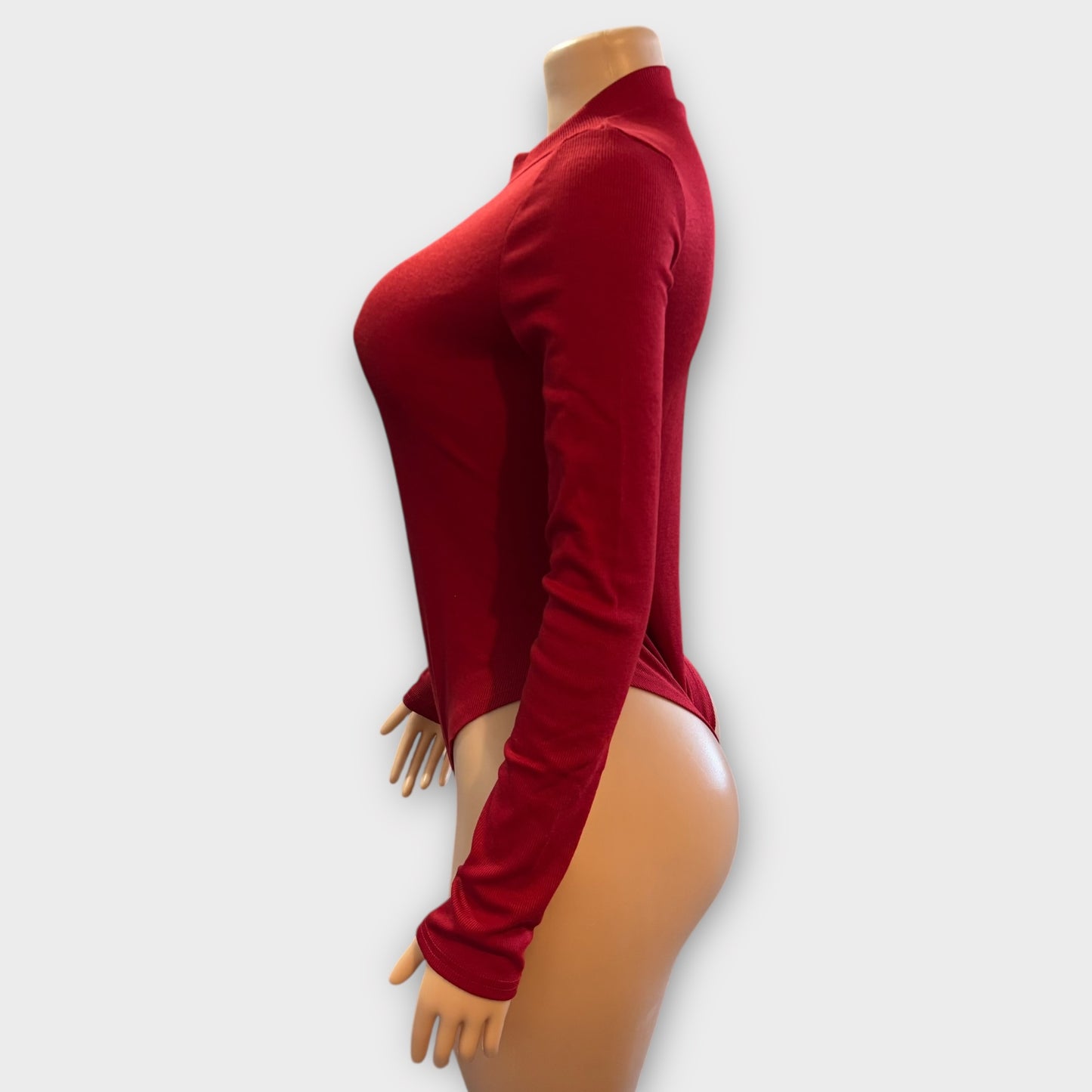 Body de mujer con cremallera en la espalda y manga larga