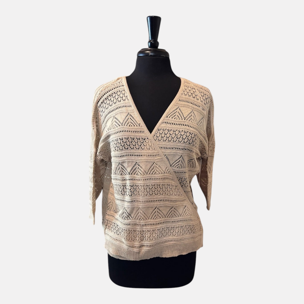 Omayra Boutique cream V-neck crossover wrap top in a textured knit cotton-acrylic blend with 3/4 sleeves.