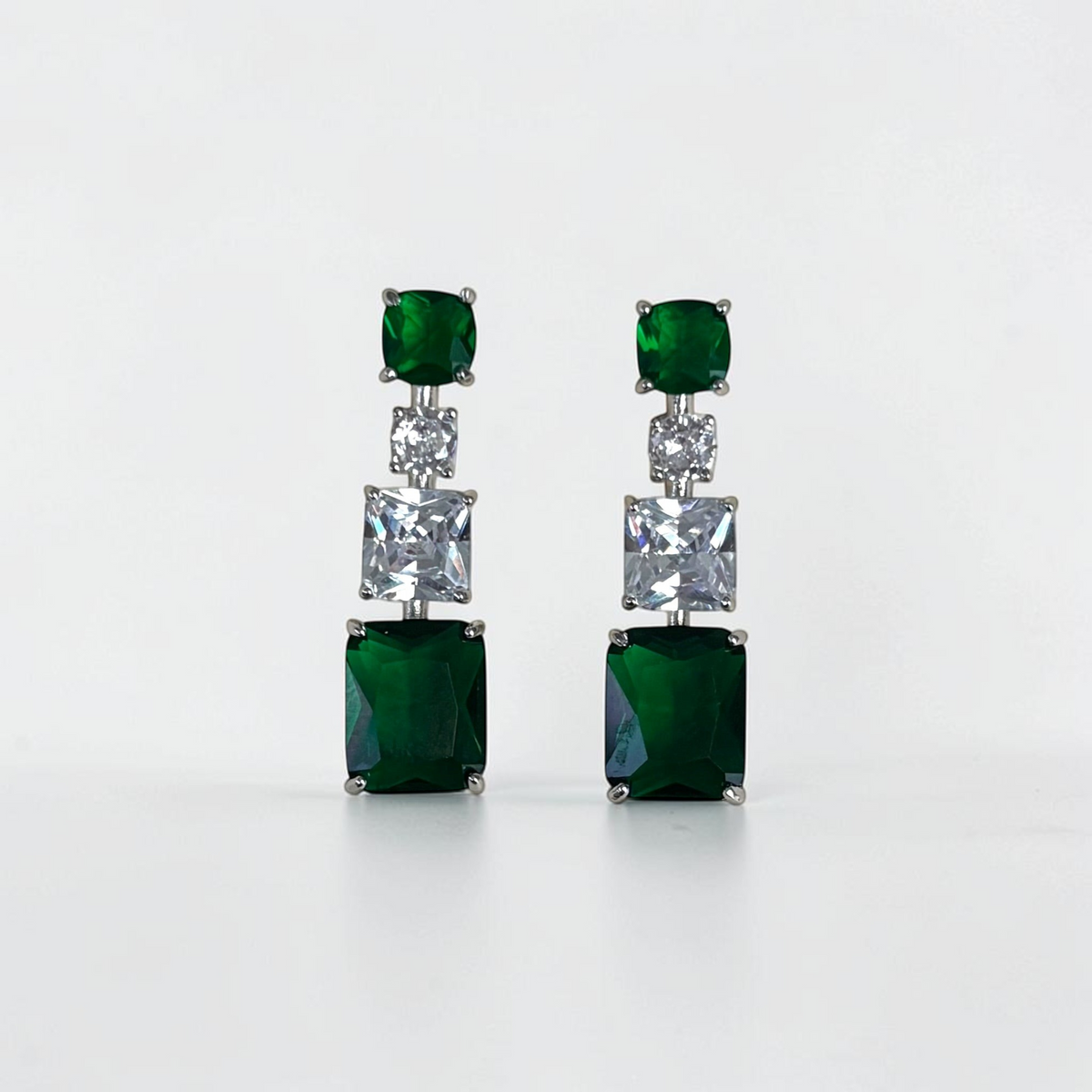 Omayra Boutique emerald green and silver drop earrings featuring square and rectangular cut stones in copper setting