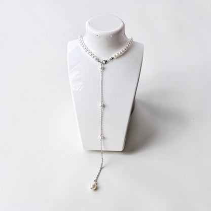 Cadena trasera con borla larga y perlas elegantes