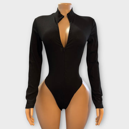 Body de mujer con cremallera en la espalda y manga larga