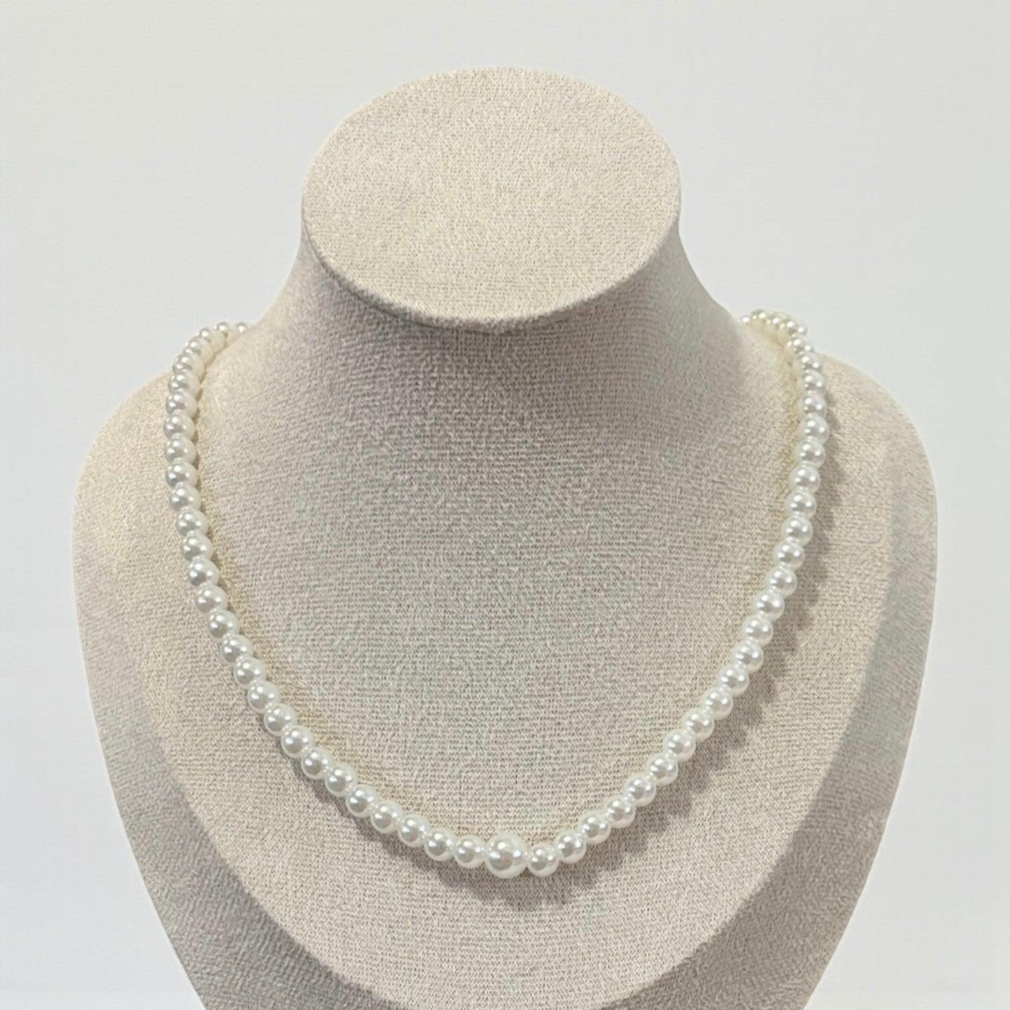 Cadena trasera con borla larga y perlas elegantes