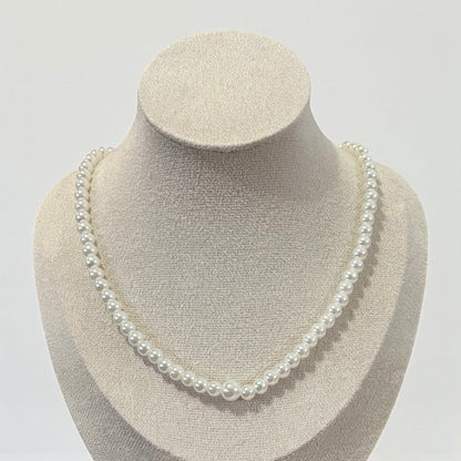 Cadena trasera con borla larga y perlas elegantes