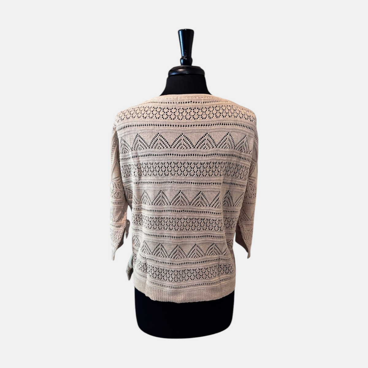 Omayra Boutique cream textured knit top with 3/4 sleeves and intricate openwork patterns on a mannequin back view