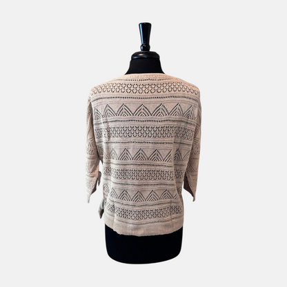 Omayra Boutique cream textured knit top with 3/4 sleeves and intricate openwork patterns on a mannequin back view