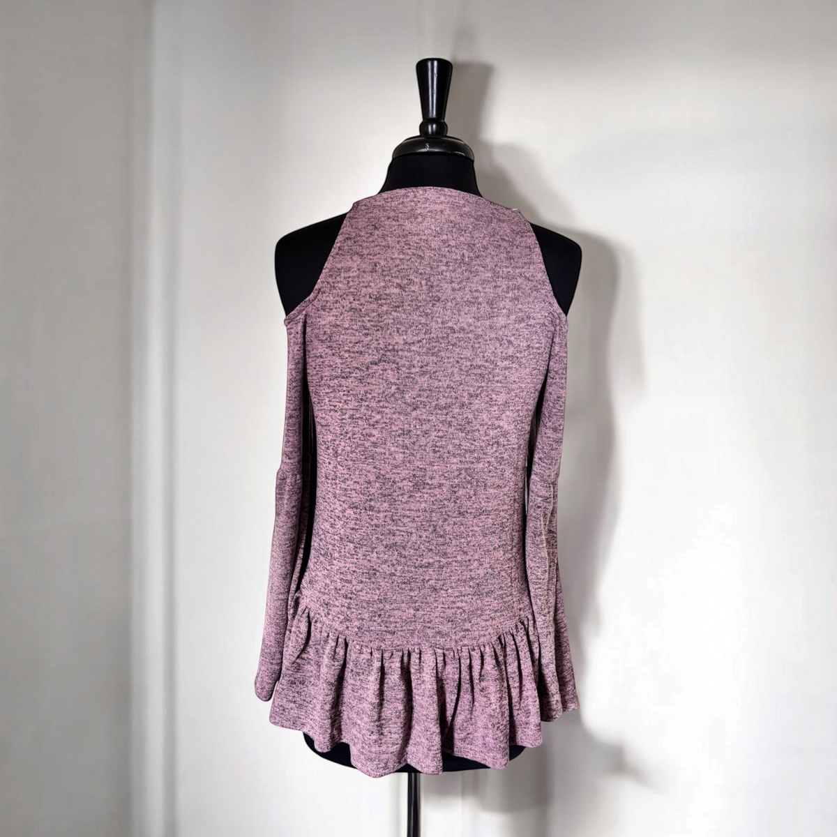 Omayra Boutique light lavender open shoulder top with 3/4 sleeves and a ruffled hem on a mannequin