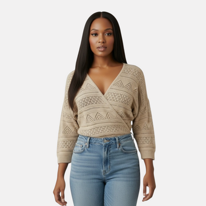 Omayra Boutique cream V-neck crossover wrap top in textured knit with 3/4 sleeves worn by a woman with blue jeans