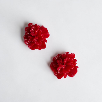Omayra Boutique red floral stud earrings crafted from lightweight zinc alloy with a vibrant glossy finish.