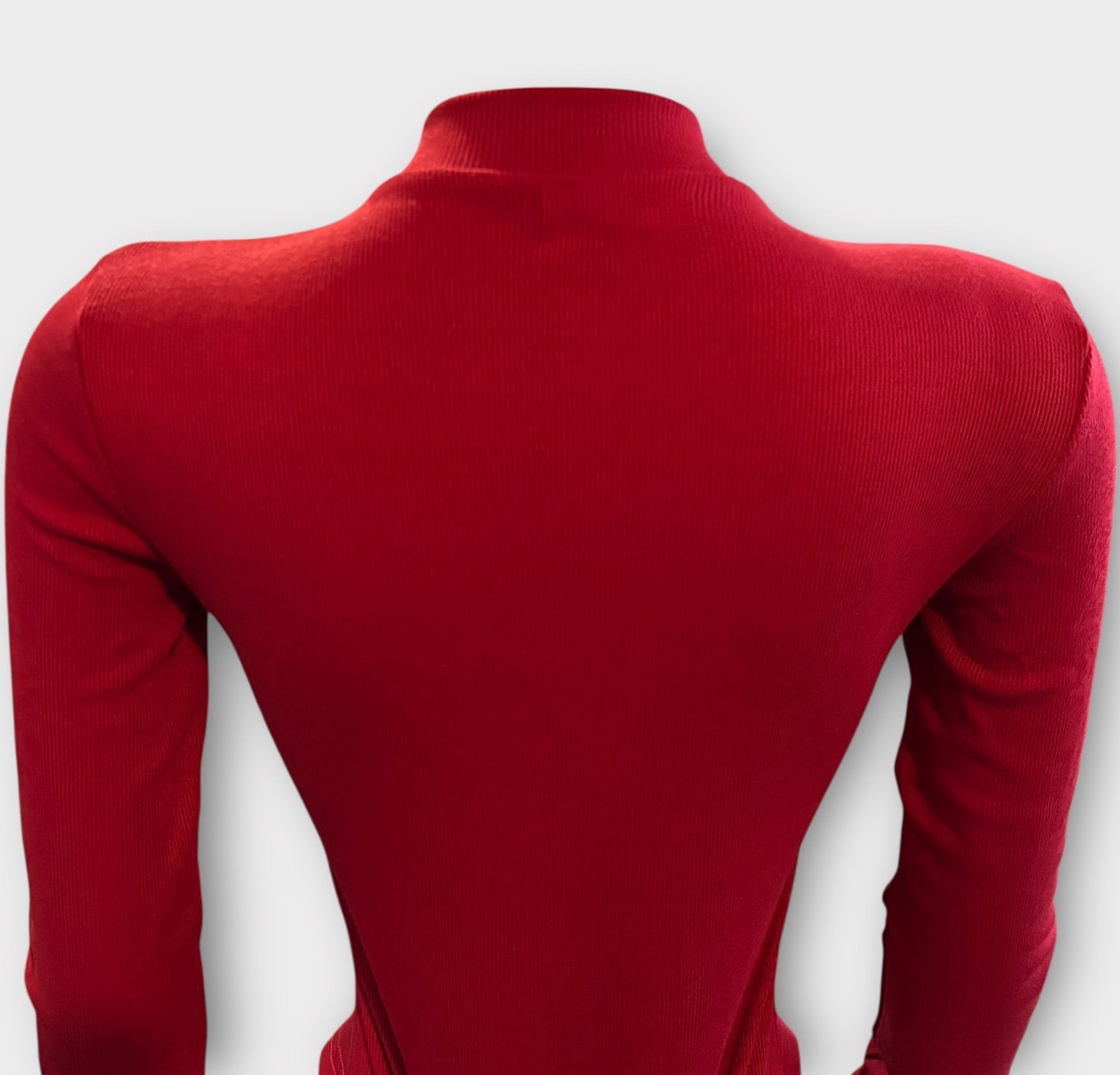 Body de mujer con cremallera en la espalda y manga larga