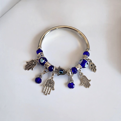 Omayra Boutique bohemian alloy bracelet with blue glass evil eye beads and silver hamsa hand charms