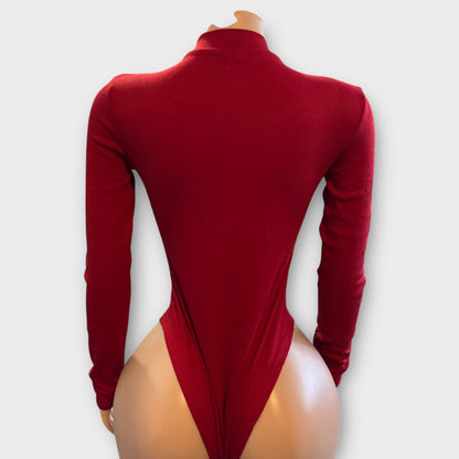 Body de mujer con cremallera en la espalda y manga larga