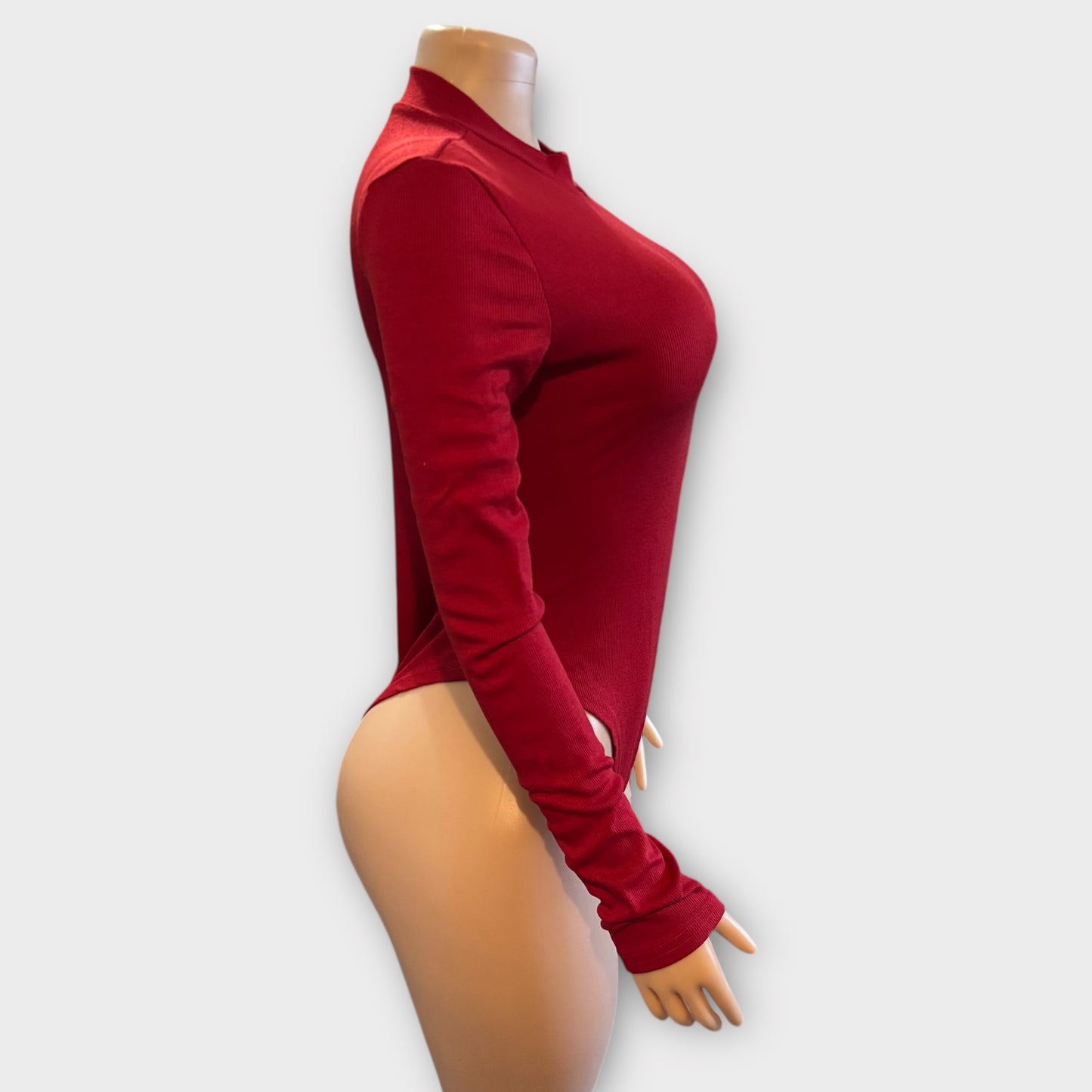 Body de mujer con cremallera en la espalda y manga larga