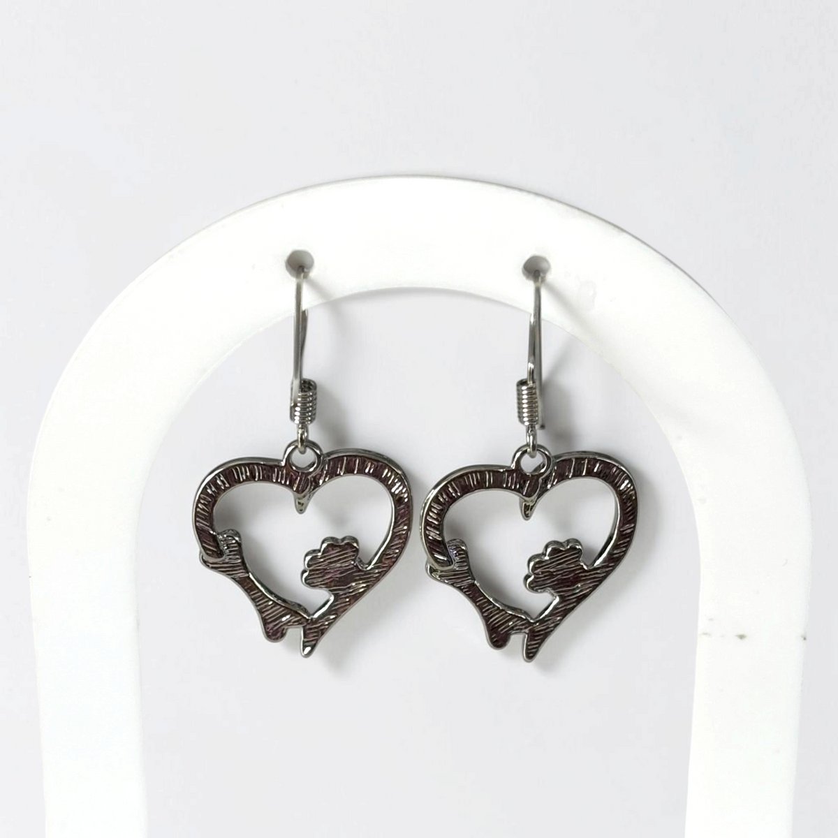 Omayra Boutique silver zinc alloy dangle earrings featuring a heart shape with a dog paw print and bone design