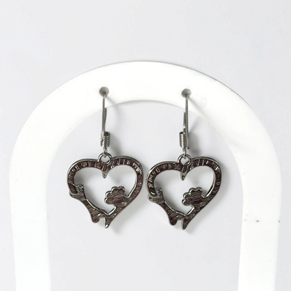 Omayra Boutique silver zinc alloy dangle earrings featuring a heart shape with a dog paw print and bone design