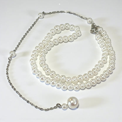 Cadena trasera con borla larga y perlas elegantes
