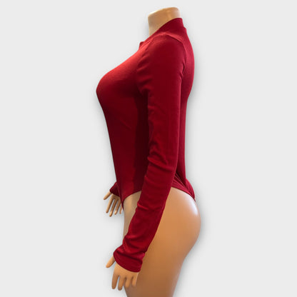 Body de mujer con cremallera en la espalda y manga larga