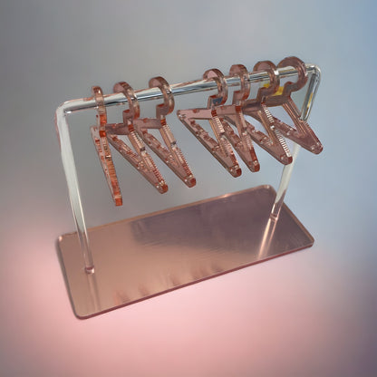 Expositor de 7 pendientes en forma de percha de color rosa