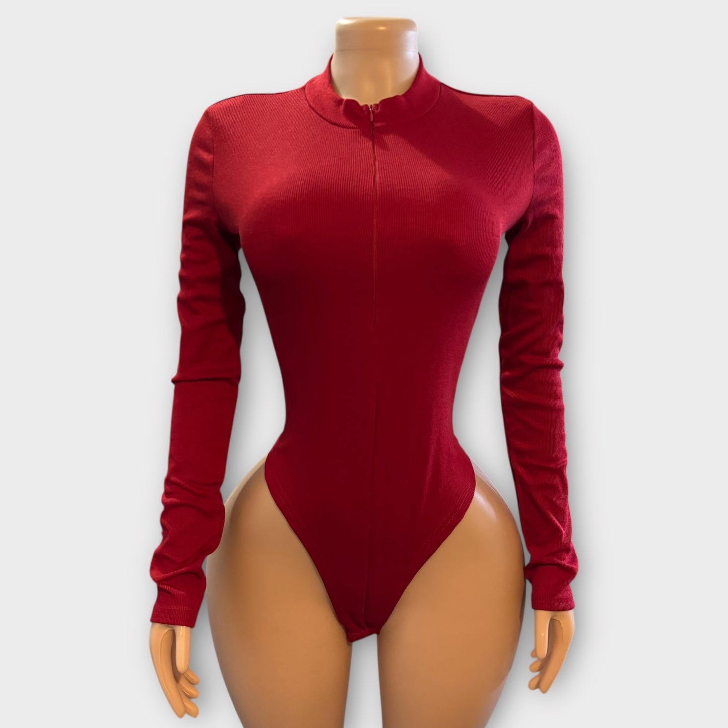 Body de mujer con cremallera en la espalda y manga larga