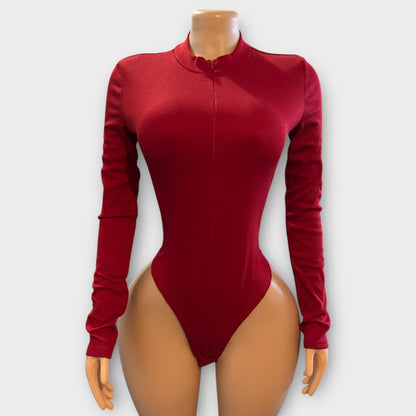 Body de mujer con cremallera en la espalda y manga larga