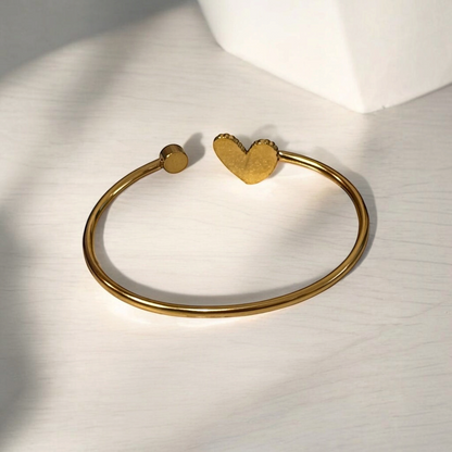Omayra Boutique gold-tone stainless steel cuff bracelet with a heart charm and a small circular accent