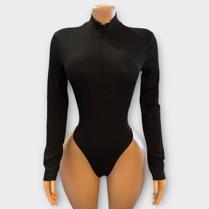 Body de mujer con cremallera en la espalda y manga larga