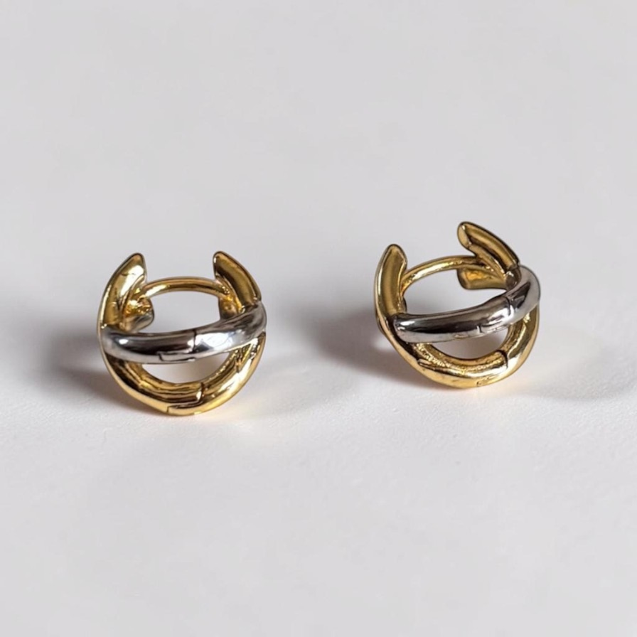 Omayra Boutique small copper stud earrings featuring a two-tone gold and silver cross-shaped color block design.