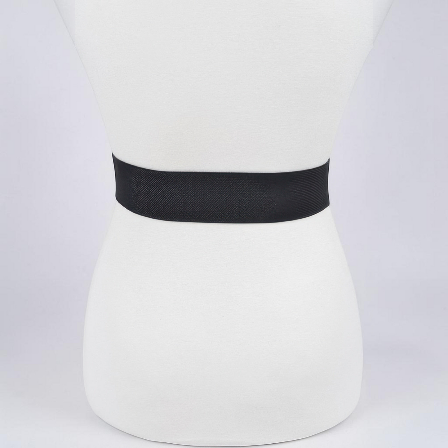 Omayra Boutique black elastic waist belt featuring a sparkling heart-shaped rhinestone buckle on a mannequin