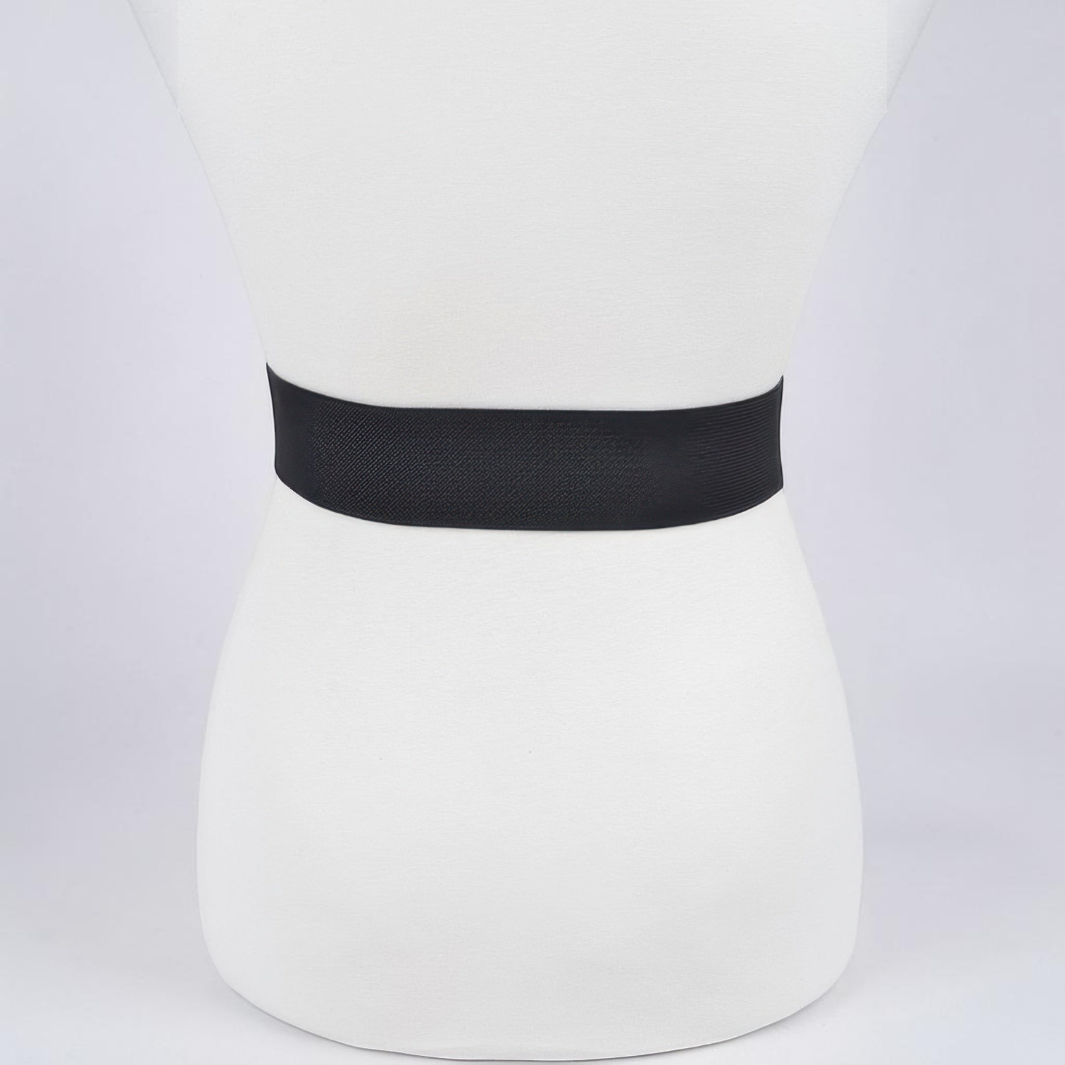 Omayra Boutique black elastic waist belt featuring a sparkling heart-shaped rhinestone buckle on a mannequin