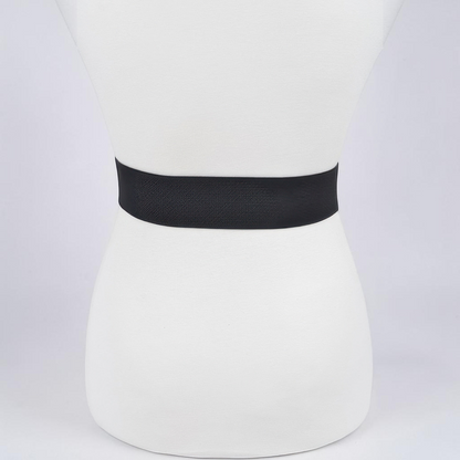 Omayra Boutique black elastic waist belt featuring a sparkling heart-shaped rhinestone buckle on a mannequin