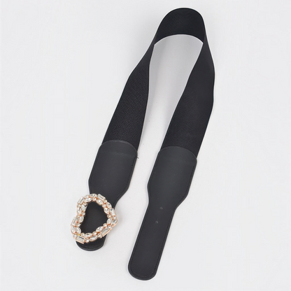 Omayra Boutique black elastic waist belt featuring a sparkling heart-shaped rhinestone buckle and faux leather ends.