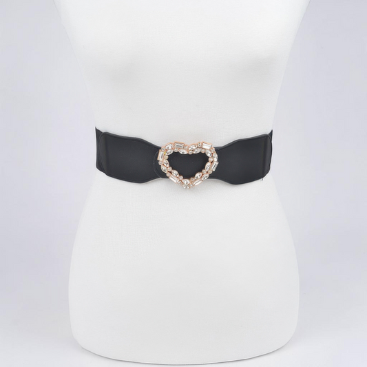 Omayra Boutique black elastic belt featuring a sparkling heart-shaped rhinestone buckle on a white mannequin torso.