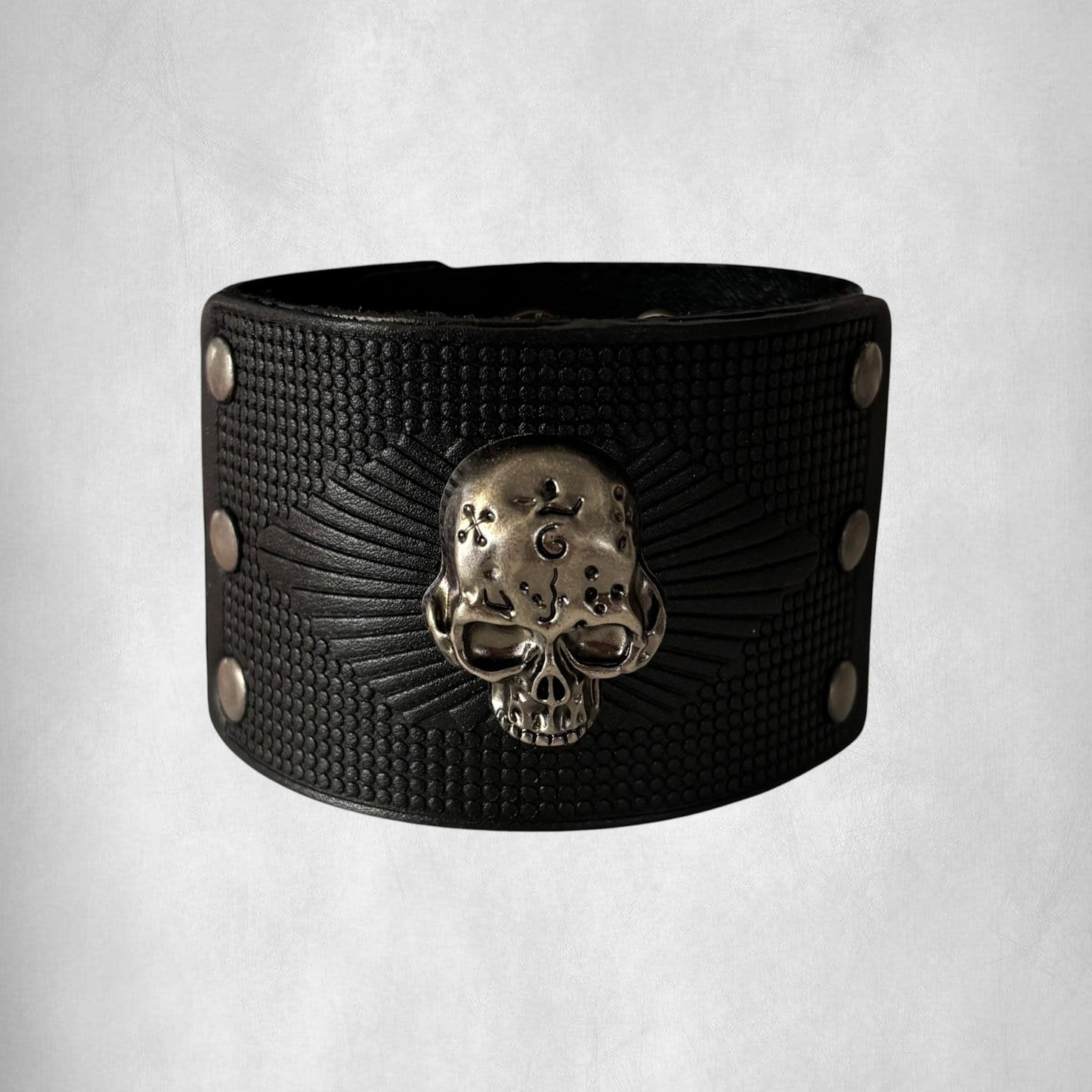 Omayra Boutique black leather men's bracelet with vintage skull detail and studded accents.