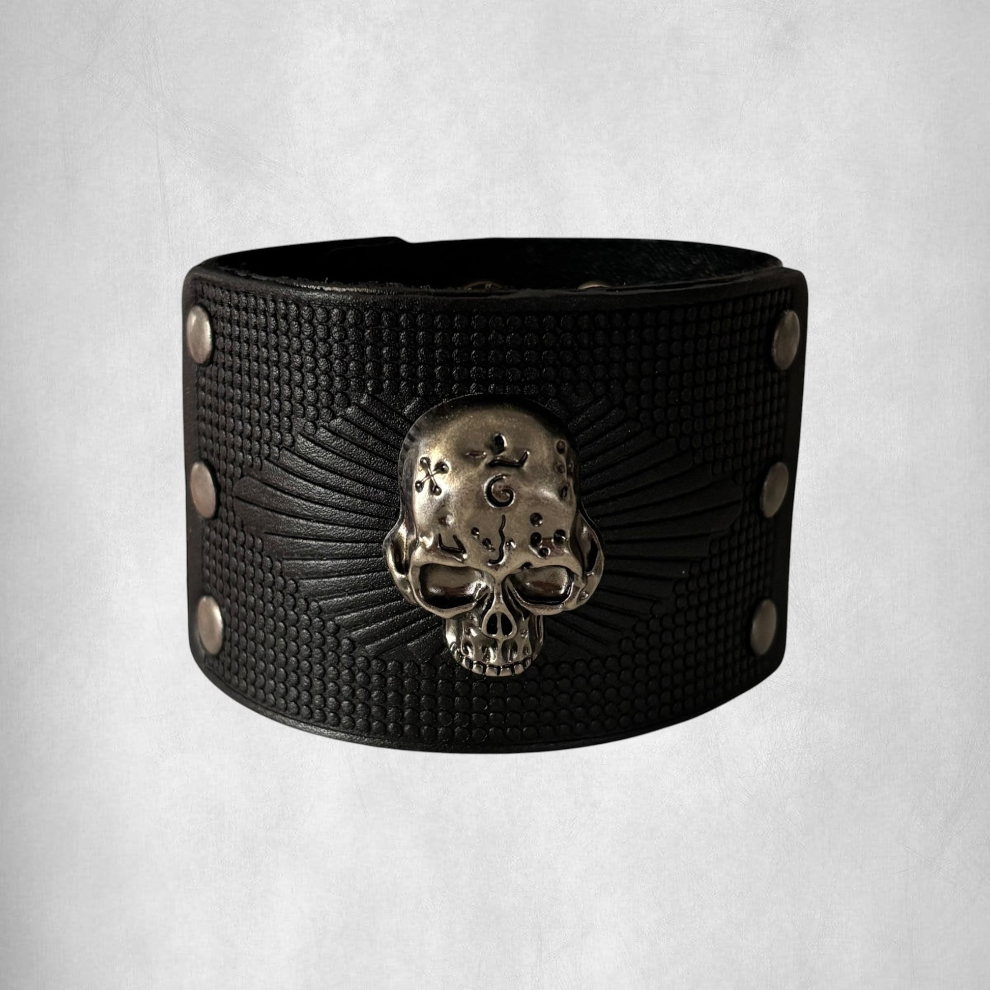 Omayra Boutique black leather men's bracelet with vintage skull detail and studded accents.