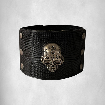 Omayra Boutique black leather men's bracelet with vintage skull detail and studded accents.