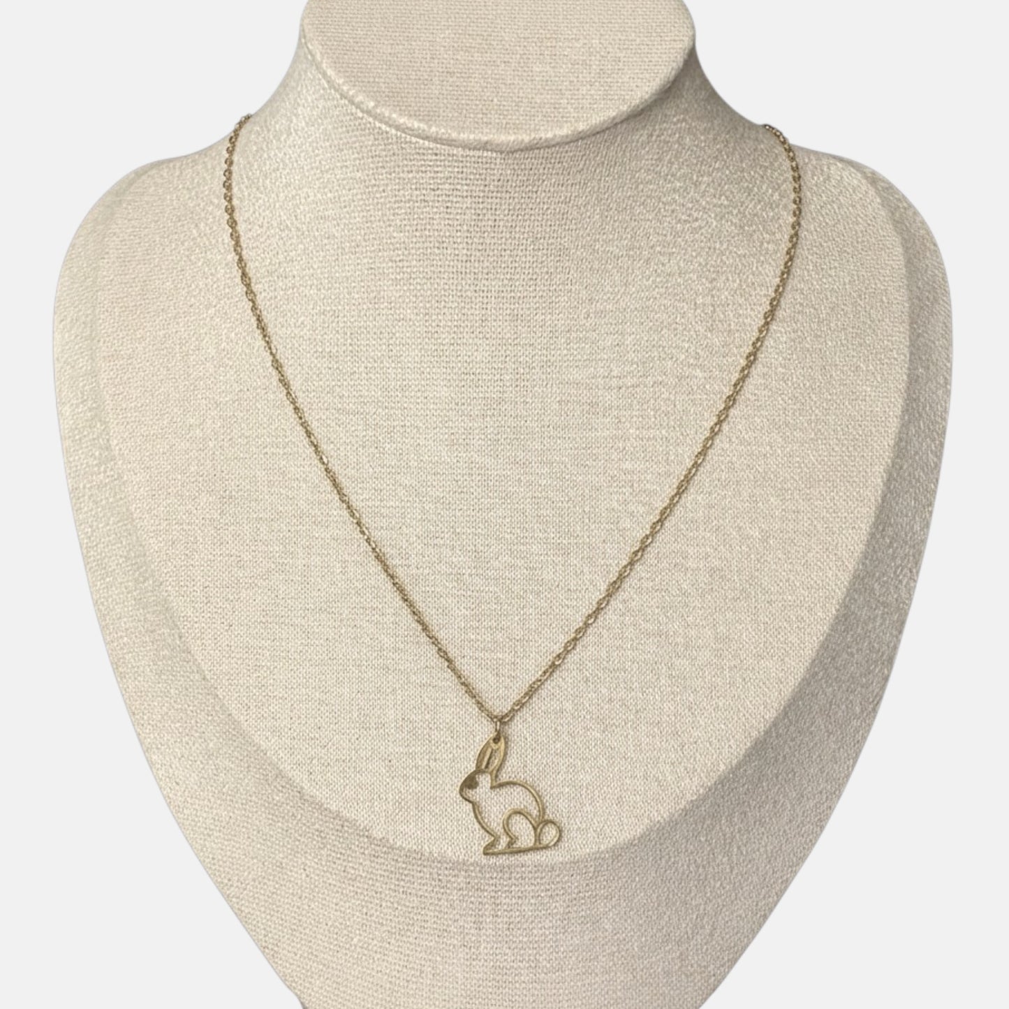 Omayra Boutique gold-tone stainless steel necklace featuring an openwork bunny pendant on a delicate link chain.