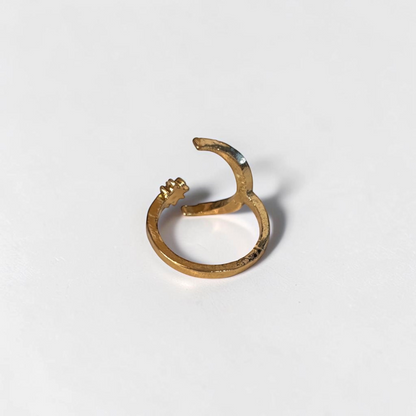 Omayra Boutique gold-tone zinc alloy open finger ring featuring a crescent moon and star design.