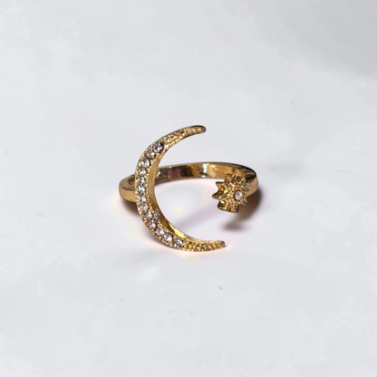 Omayra Boutique gold-tone adjustable open finger ring featuring a crystal-studded crescent moon and star design.