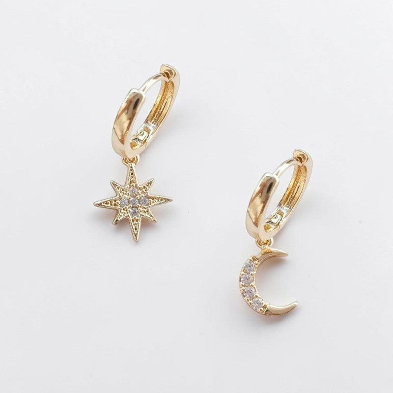Omayra Boutique gold-plated hoop earrings featuring a dainty star and moon charm with sparkling crystal accents.