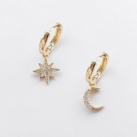 Omayra Boutique gold-plated hoop earrings featuring a dainty star and moon charm with sparkling crystal accents.