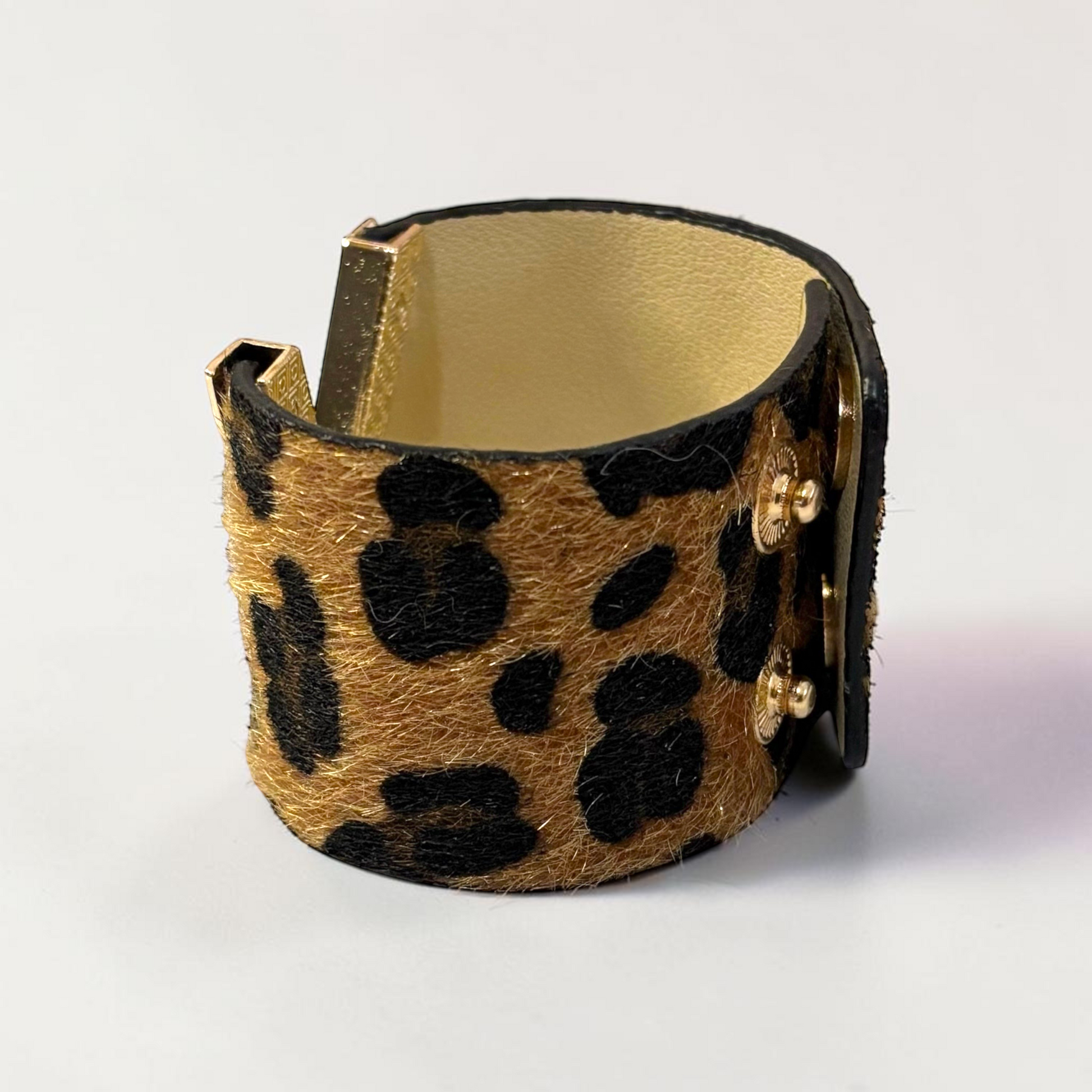 Omayra Boutique brown leopard print leather cuff bracelet with gold-tone metal accents and double safety clasp