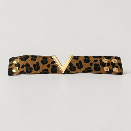 Omayra Boutique brown leopard print leather cuff bracelet with a gold V-shaped charm and double snap closure.