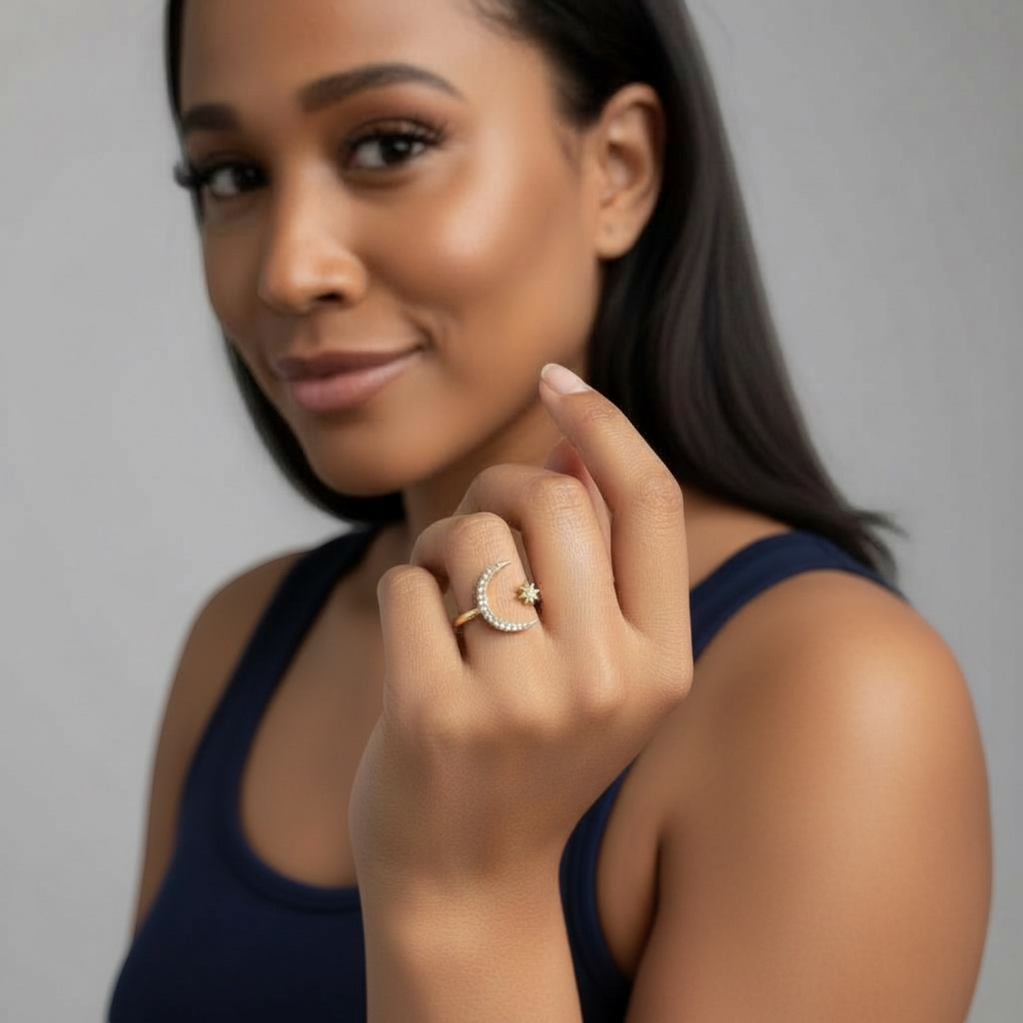 Omayra Boutique adjustable open finger ring featuring a sparkling moon and star design on a woman's hand
