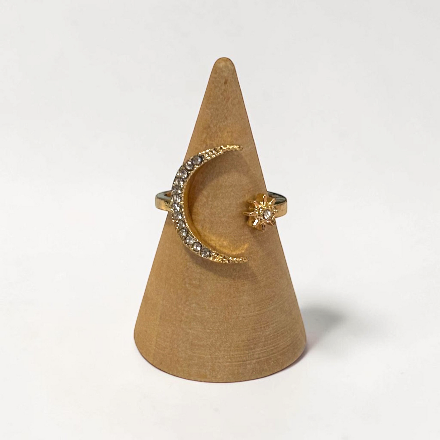 Omayra Boutique gold-tone open finger ring featuring a crystal-encrusted crescent moon and star design.