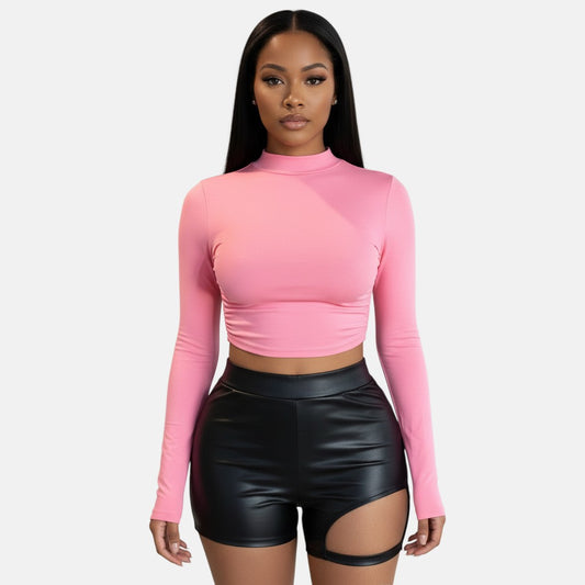 Omayra Boutique pink long sleeve cropped top with ruched sides and open back detail, made of cotton blend.