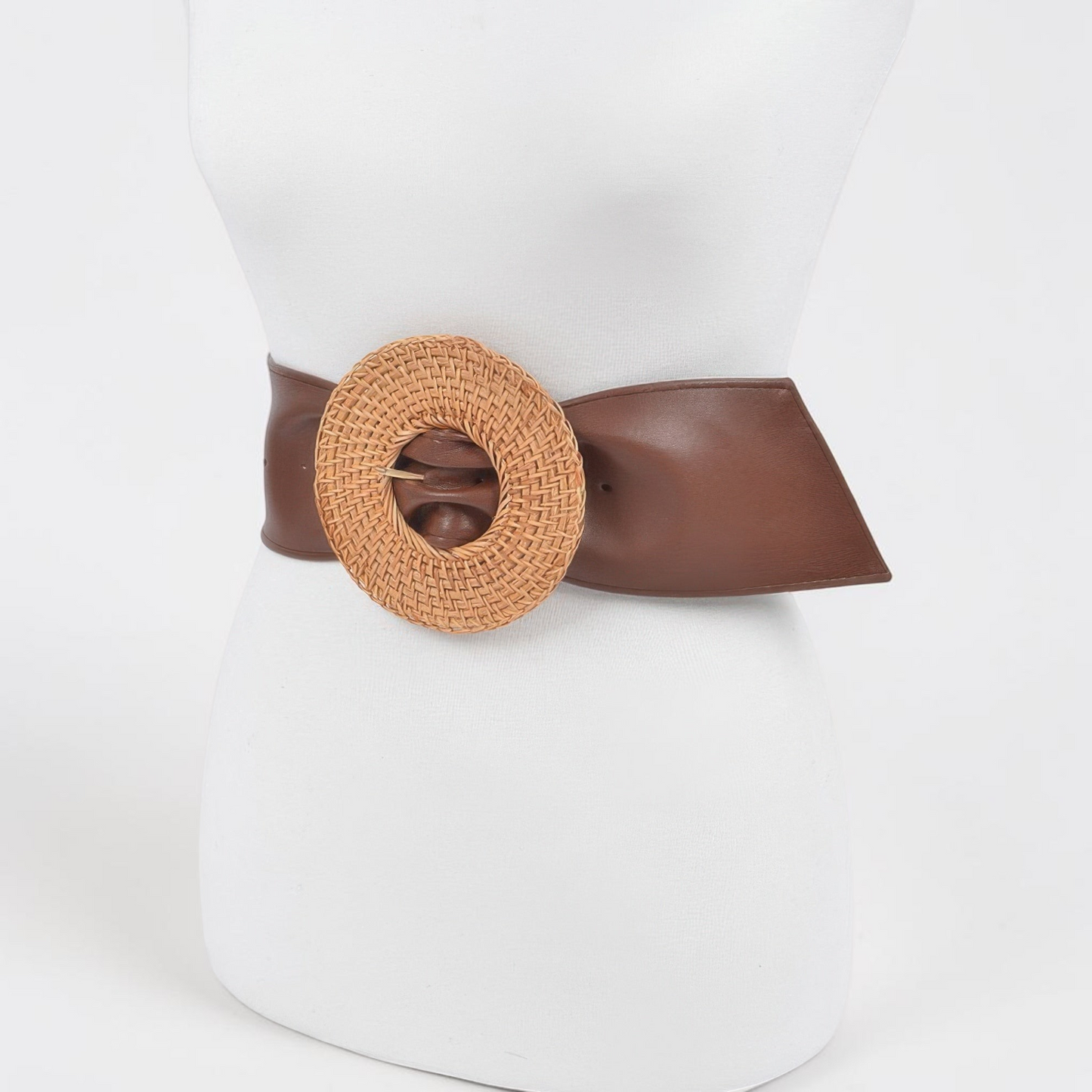 Omayra Boutique plus size brown polyurethane belt featuring a large round woven bamboo-style buckle on a mannequin.