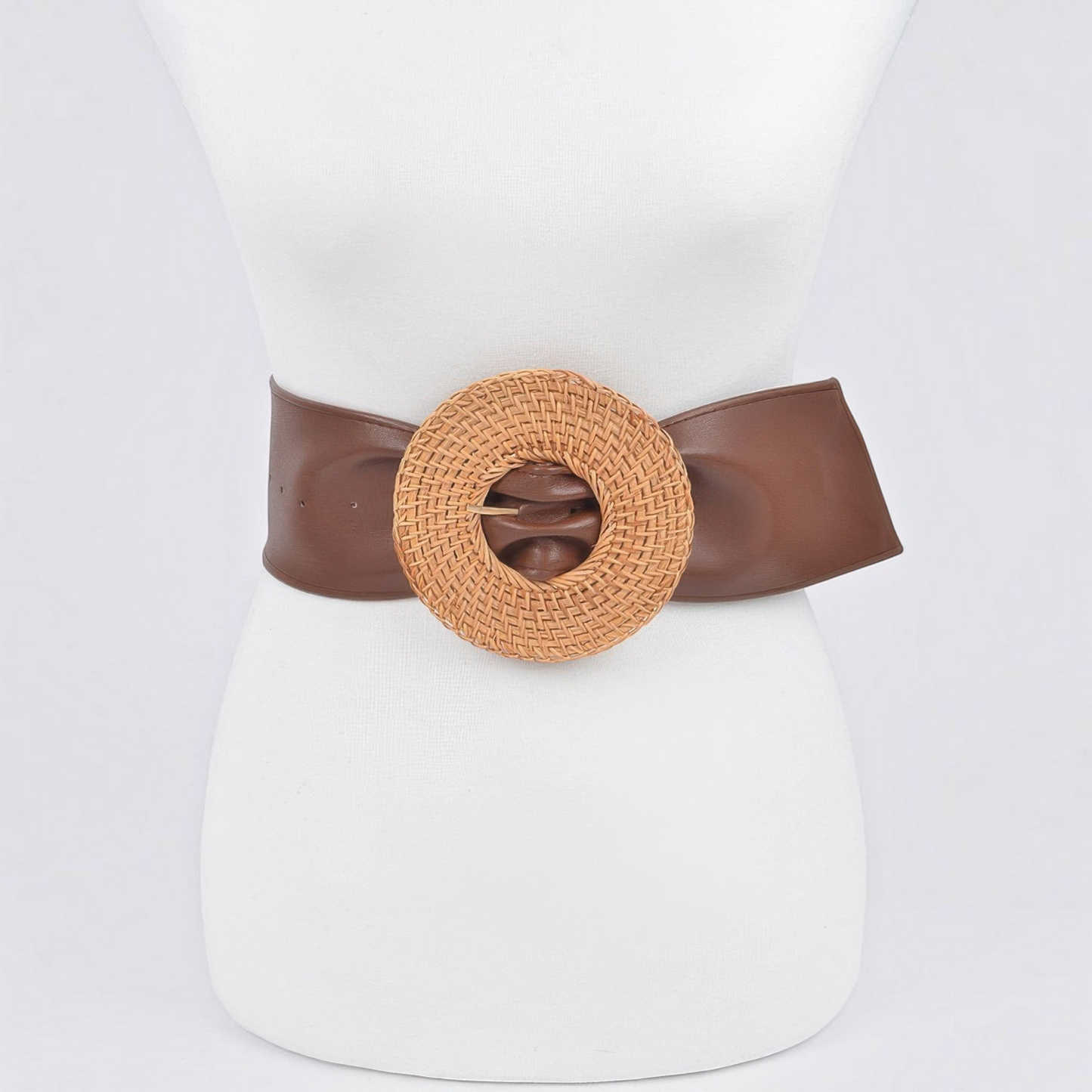Omayra Boutique plus size brown polyurethane belt featuring a large round woven bamboo-style buckle on a mannequin