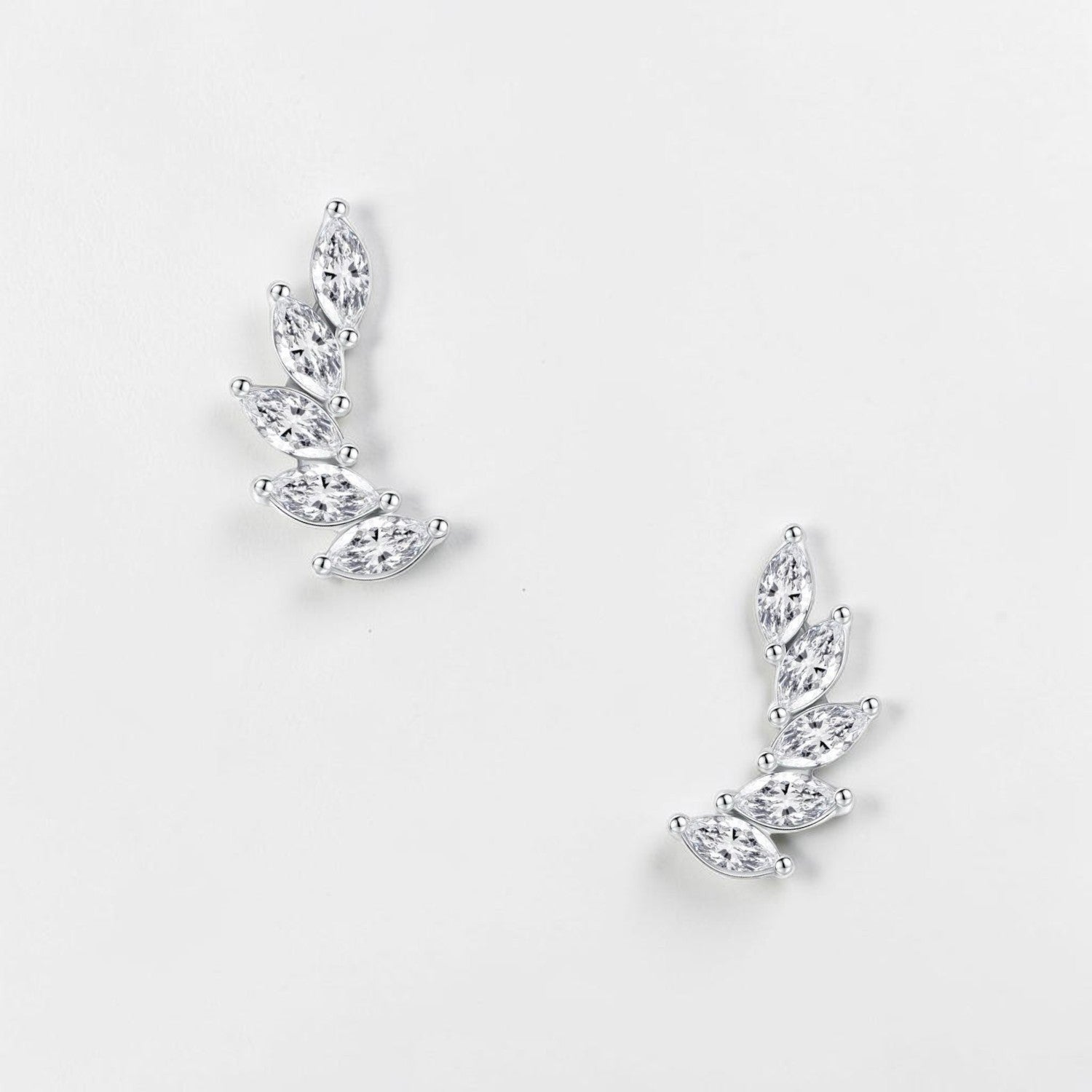Omayra Boutique 925 sterling silver wing feather earrings featuring marquise-cut clear stones in a curved climber style.