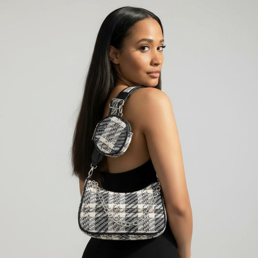 Omayra Boutique tweed plaid shoulder bag with matching mini AirPod pouch and chain detail worn by a woman.