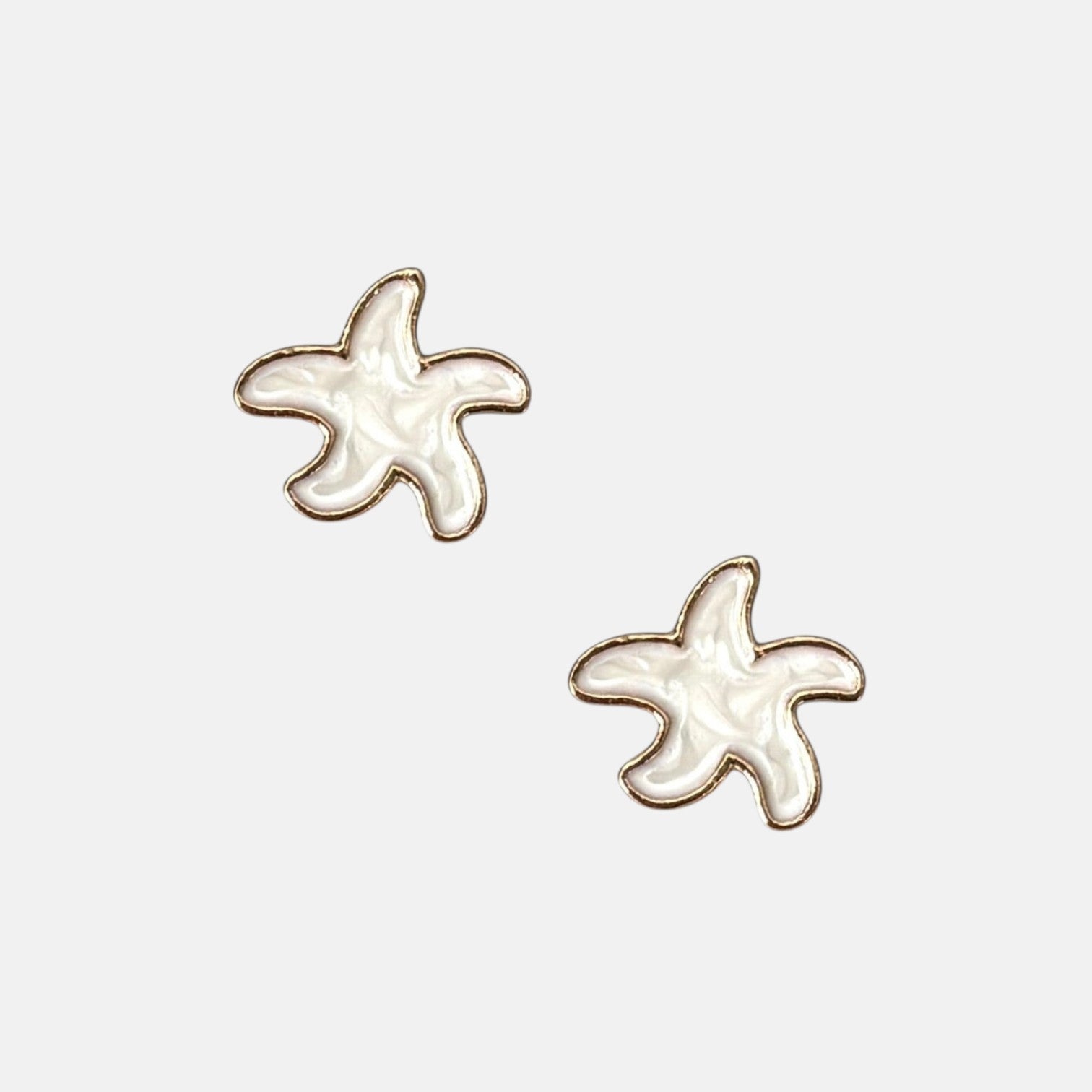 Omayra Boutique small white starfish stud earrings with gold trim, 1/2-inch, coastal bohemian style.